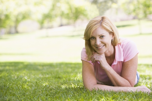 Woman lying down in a park